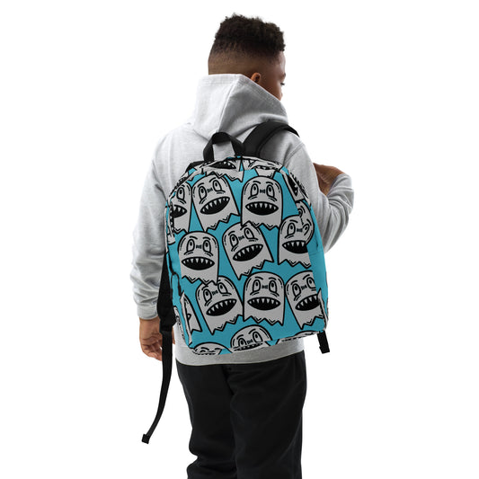 Backpack with grinning goblin pattern on a bright blue background