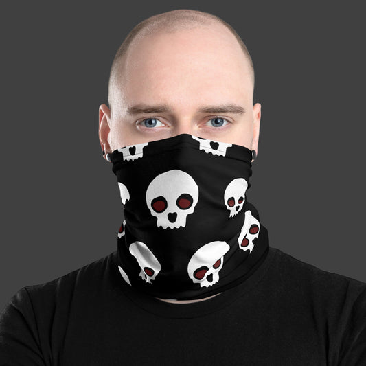 Man wearing a black neck gaiter with skulls over his face