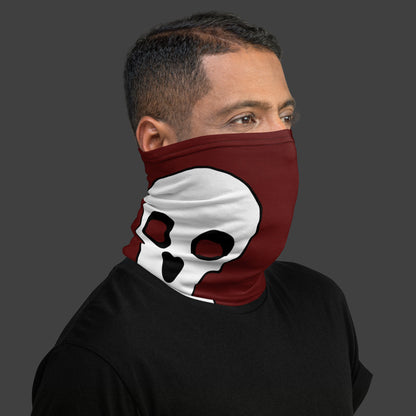 man wearing a deep red neck gaiter with large skull prints over his face