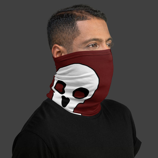 man wearing a deep red neck gaiter with large skull prints over his face