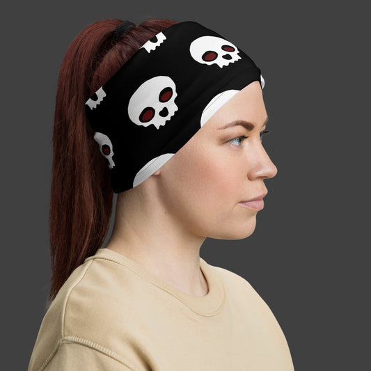 woman wearing a black neck gaiter with skulls as a head bandana