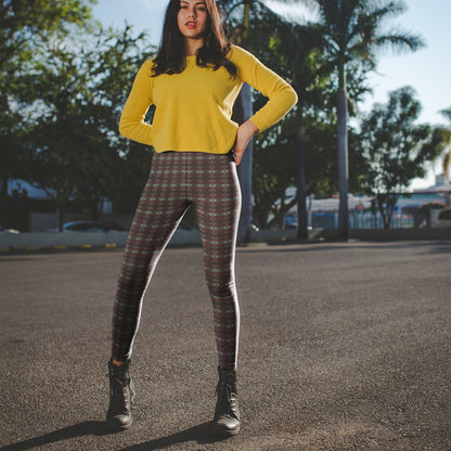 person wearing a darker almost black version of the red plaid classic punk pattern leggings