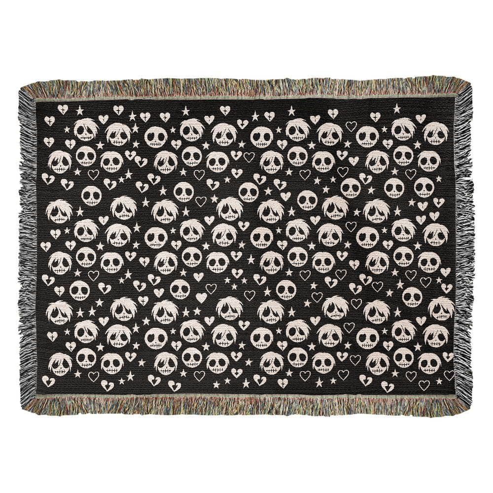 a woven blanket with a pattern of stitch mouthed emo ghouls and broken hearts on a dark background