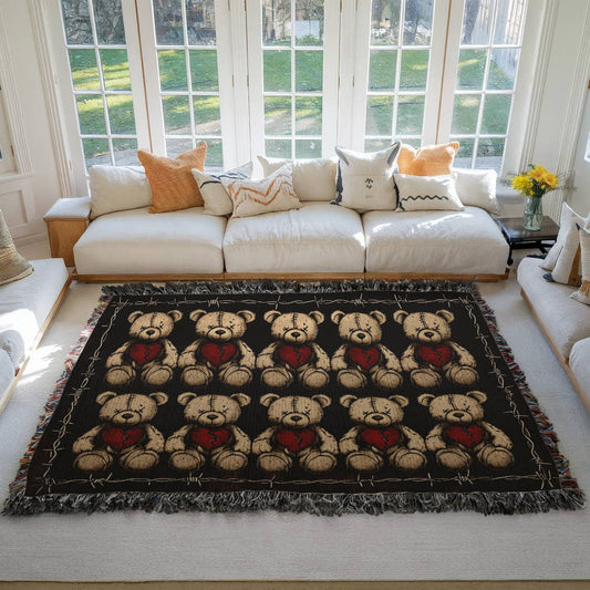 a woven blanket with x-eyed teddy bears on a dark background and surrounded by a frame of barbed wire on a living room floor