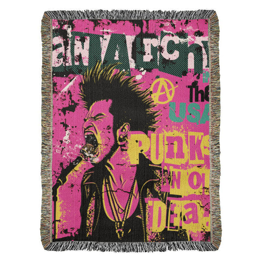 a woven blanket with a punk collage in pink black and yellow and text anarchy in the usa