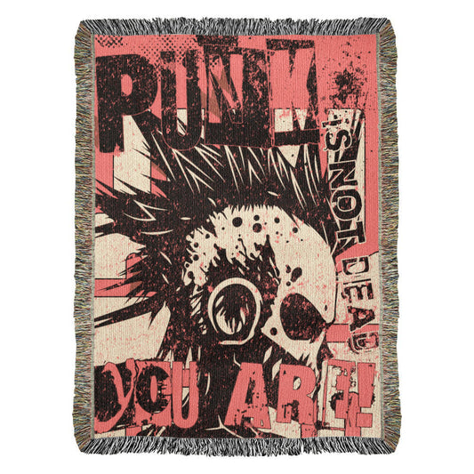 a woven blanket with a punk collage in pink and black, with text and a mohawk skull