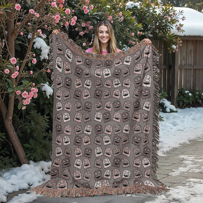 a woven blanket with a purplish grey and pink goblin pattern