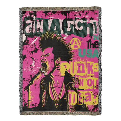 a woven blanket with a punk collage in pink black and yellow and text anarchy in the usa