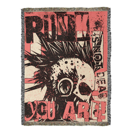 a woven blanket with a punk collage in pink and black, with text and a mohawk skull