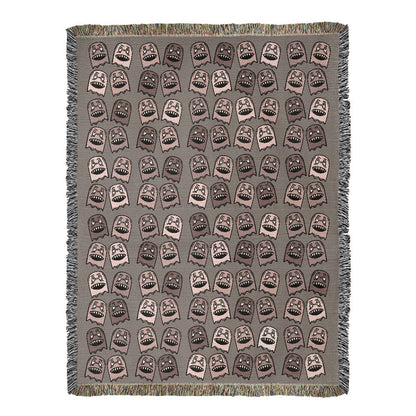 a woven blanket with a purplish grey and pink goblin pattern