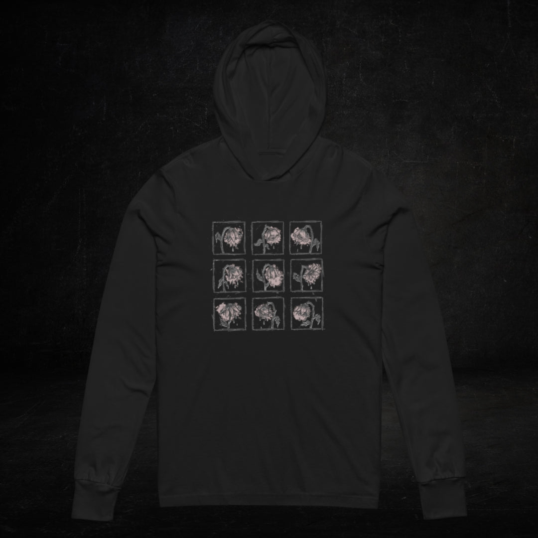a black Hooded Long-Sleeve Bella Canvas 3512 tee with a grid of crying emo flowers in soft pink