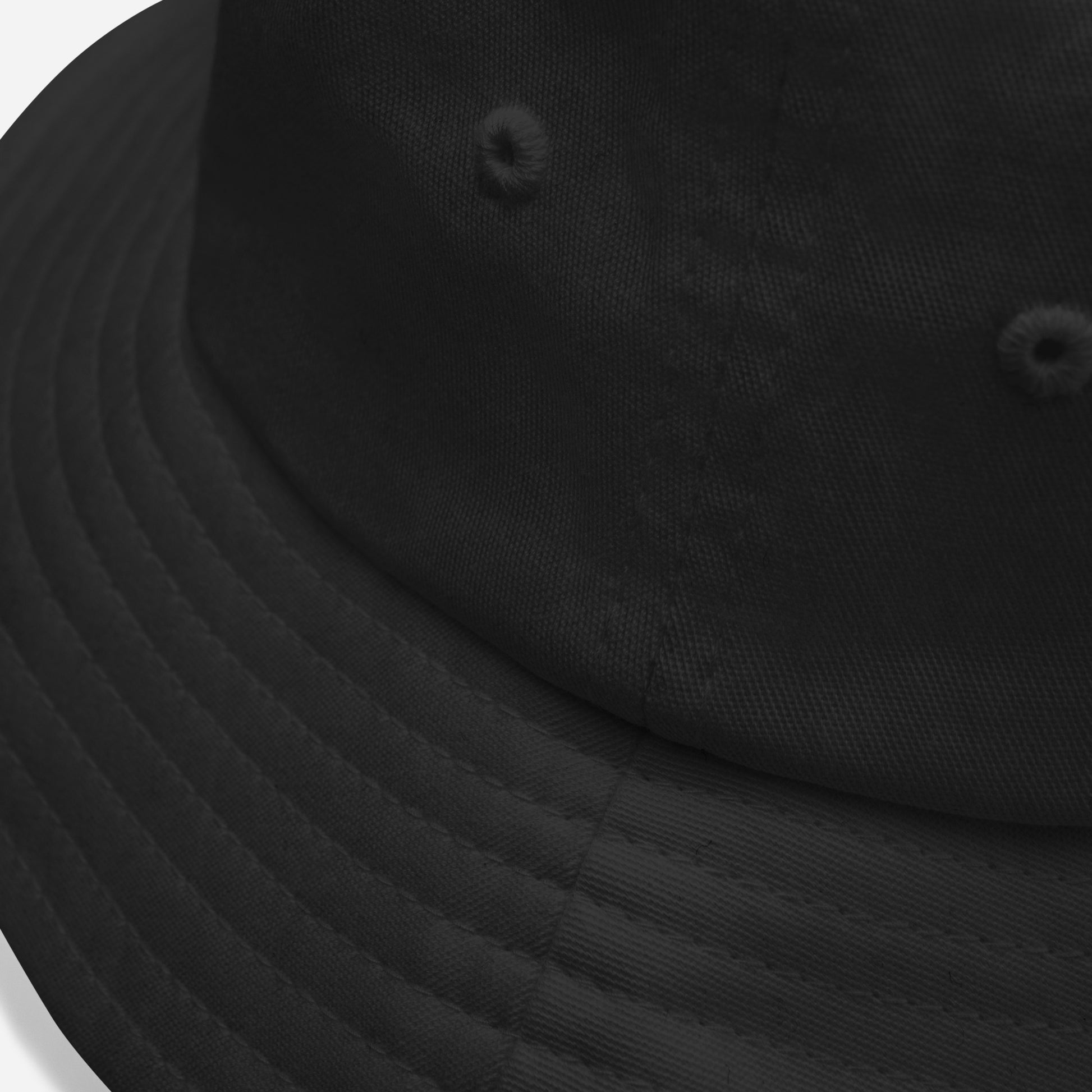 detail of an old school black bucket hat with embroidered text "beware"