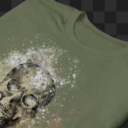A military green tee with skull graphic surrounded and overlaid with paint splatter in camouflage colors