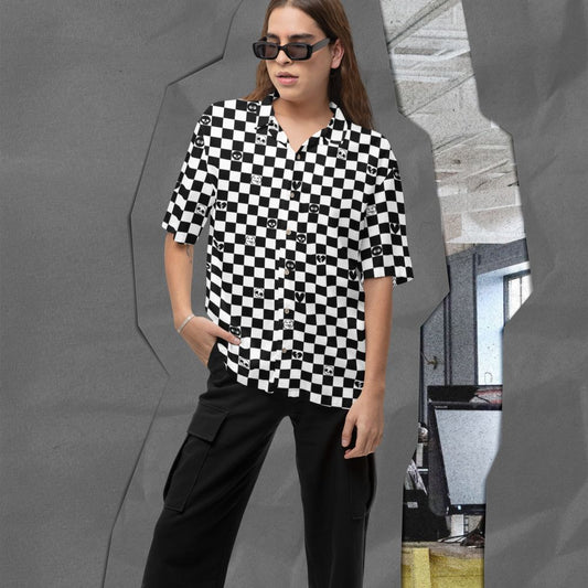 woman wearing a black and white checkered button up shirt wit emo symbols