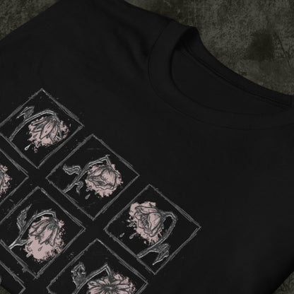 a black gildan 64000 tee with a grid of sad crying flowers in soft pink