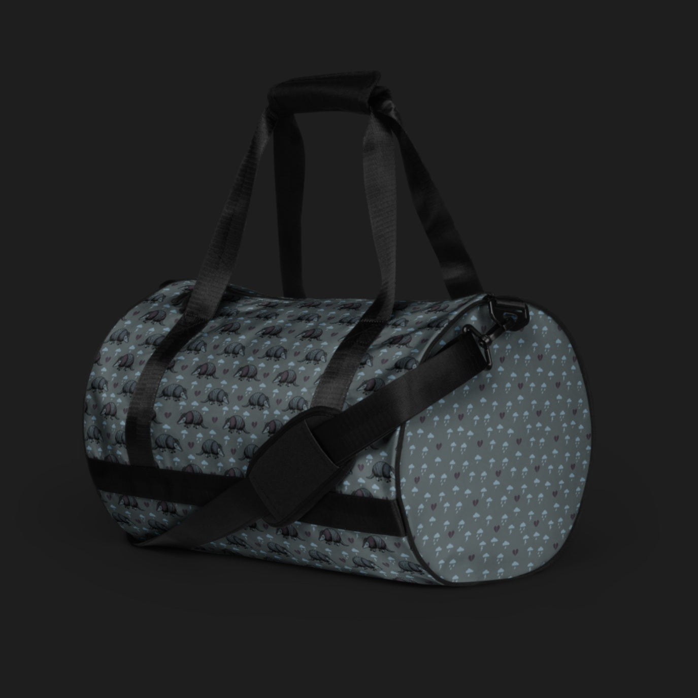 a duffel gym bag with an emo armadillo pattern with broken hearts and storm clouds