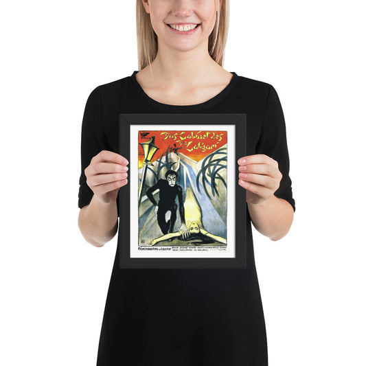 woman holding a framed vintage poster for the movie The Cabinet of Dr. Caligari 