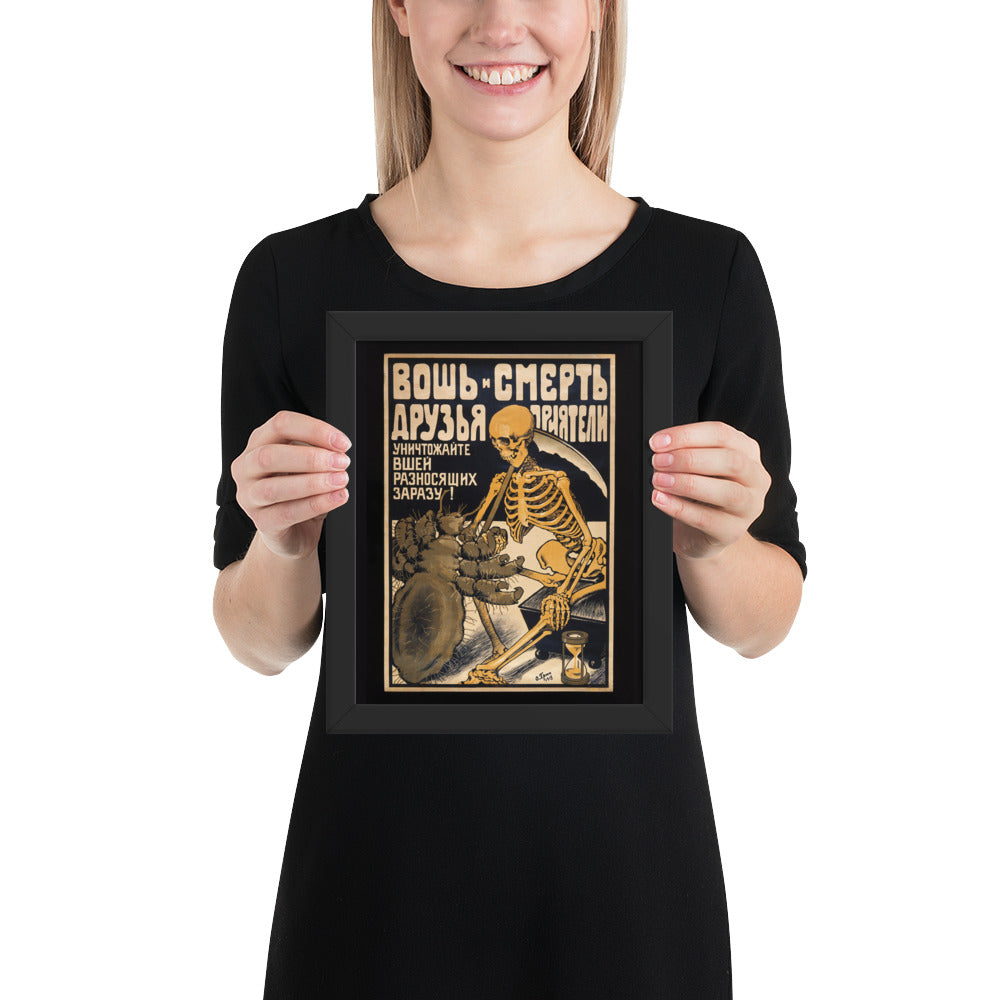 Woman holding a framed vintage poster of the Russian "The typhus louse shaking hands with Death"