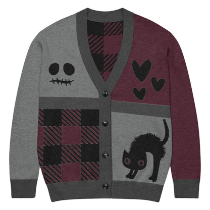 a knitted cardigan with patchwork like design, plaid, hearts, spooky eyes and a cat