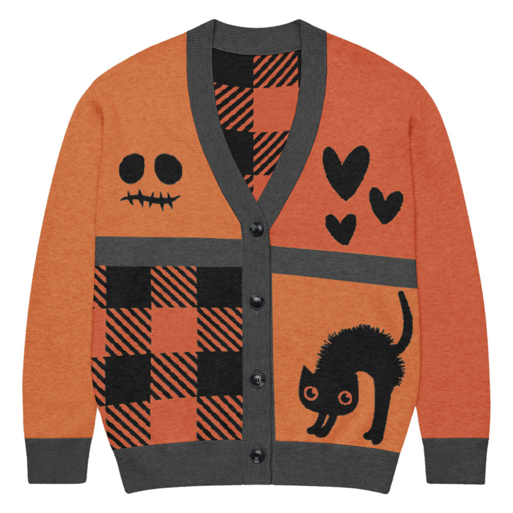 a knitted cardigan with patchwork like design, plaid, hearts, spooky eyes and a cat