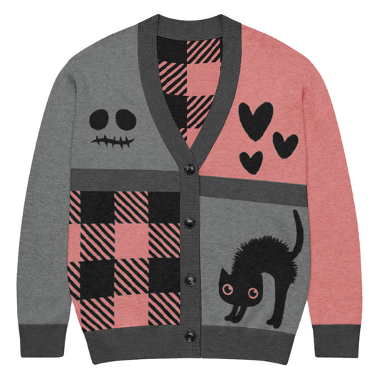 a knitted cardigan with patchwork like design, plaid, hearts, spooky eyes and a cat