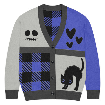a knitted cardigan with patchwork like design, plaid, hearts, spooky eyes and a cat