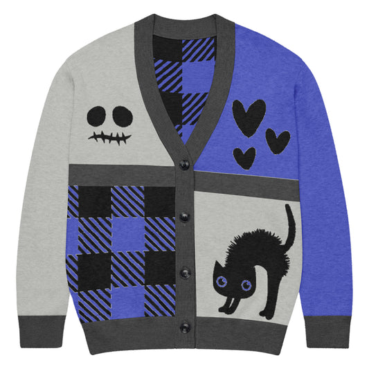 a knitted cardigan with patchwork like design, plaid, hearts, spooky eyes and a cat