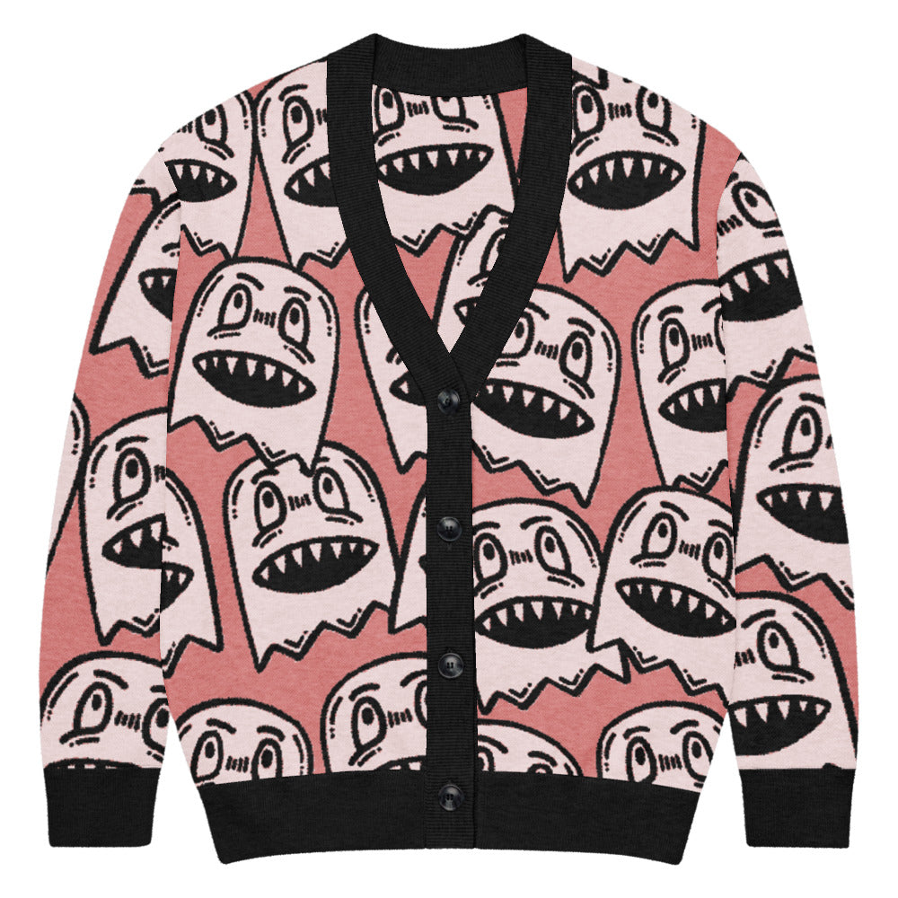 pink knitted cardigan with large grinning goblin heads in scene and grunge style