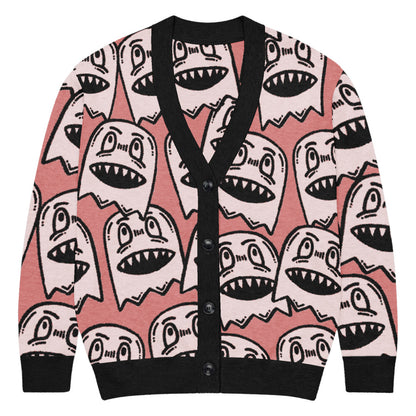 pink knitted cardigan with large grinning goblin heads in scene and grunge style