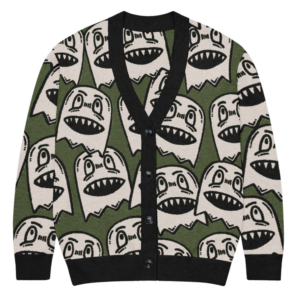 green knitted cardigan with large grinning goblin heads in scene and grunge style