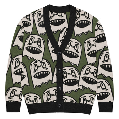 green knitted cardigan with large grinning goblin heads in scene and grunge style