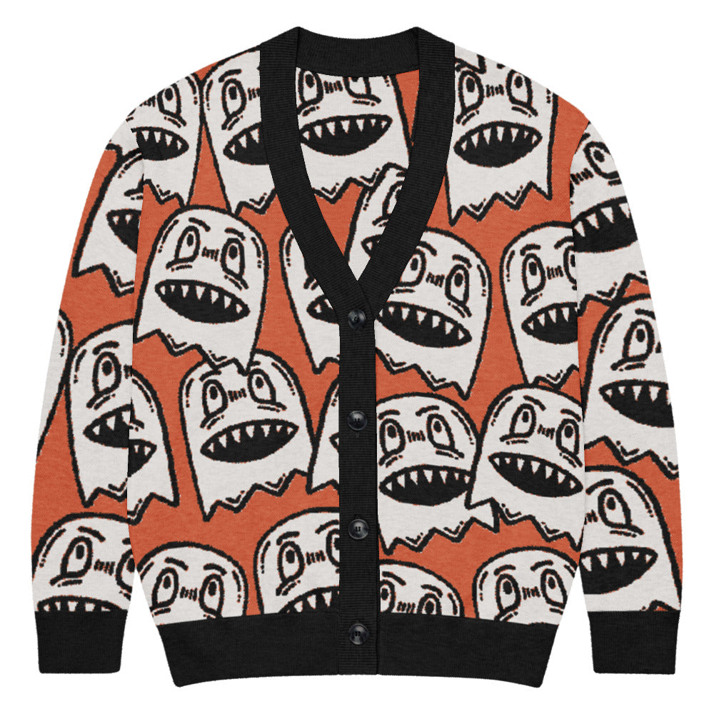 orange knitted cardigan with large grinning goblin heads in scene and grunge style