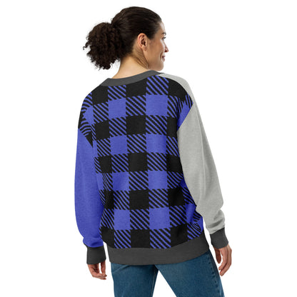 woman wearing a knitted cardigan with patchwork like design, plaid, hearts, spooky eyes and a cat