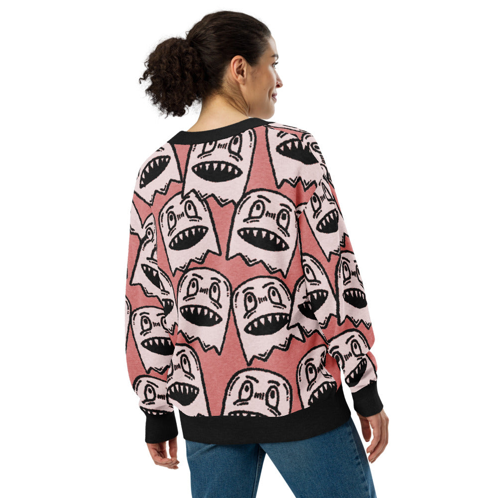 pink knitted cardigan with large grinning goblin heads in scene and grunge style