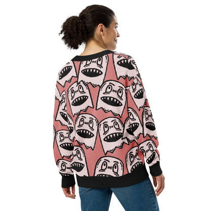 pink knitted cardigan with large grinning goblin heads in scene and grunge style