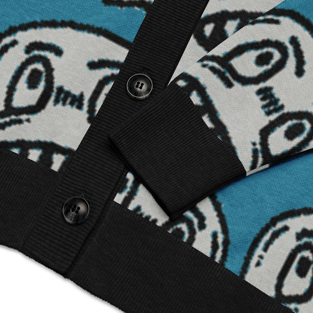 details of an electric blue knitted cardigan with large grinning goblin heads in scene and grunge style