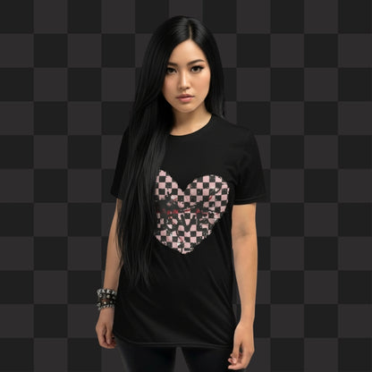 Person wearing a black t-shirt with a pink and black cracked distressed checkered heart and the text love partly obscured