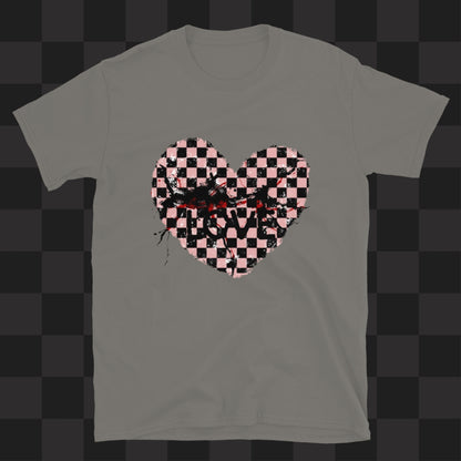A grey gildan 64000 t-shirt with a pink and black cracked distressed checkered heart and the text love partly obscured.