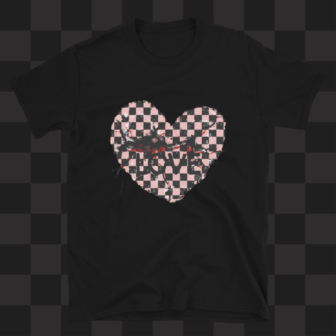 A black gildan 64000 t-shirt with a pink and black cracked distressed checkered heart and the text love partly obscured.