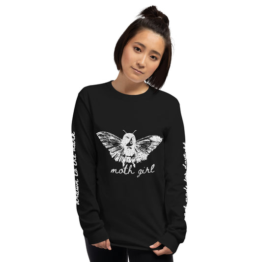 a woman wearing a black long sleeve tee with moth girl print in front and back and text on sleeves