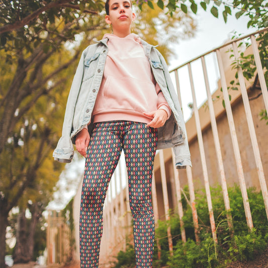 woman wearing leggings with a colorful diamond pattern