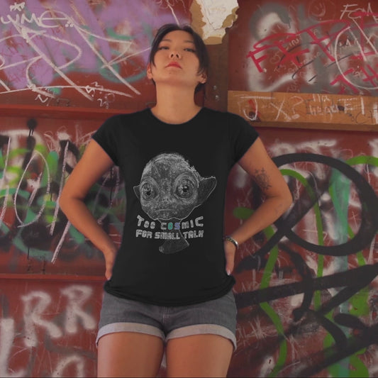 serious woman wearing a black t-shirt with an alien and the text "too cosmic for small talk"
