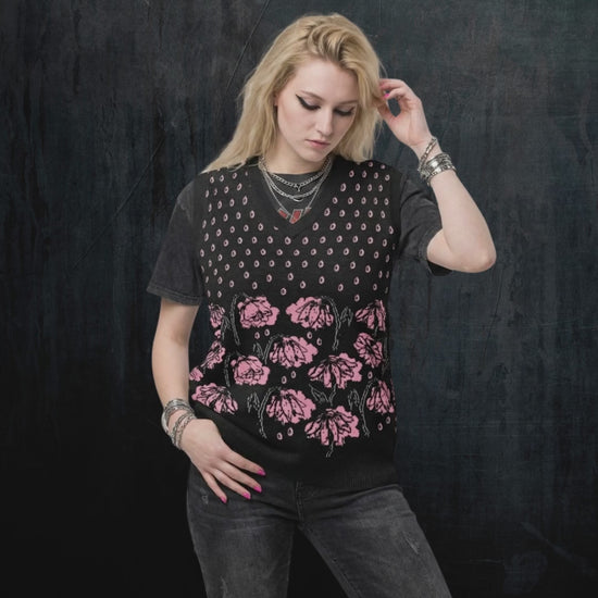 Alt style person wearing a black knitted vest with crying pink flowers and droplets product video