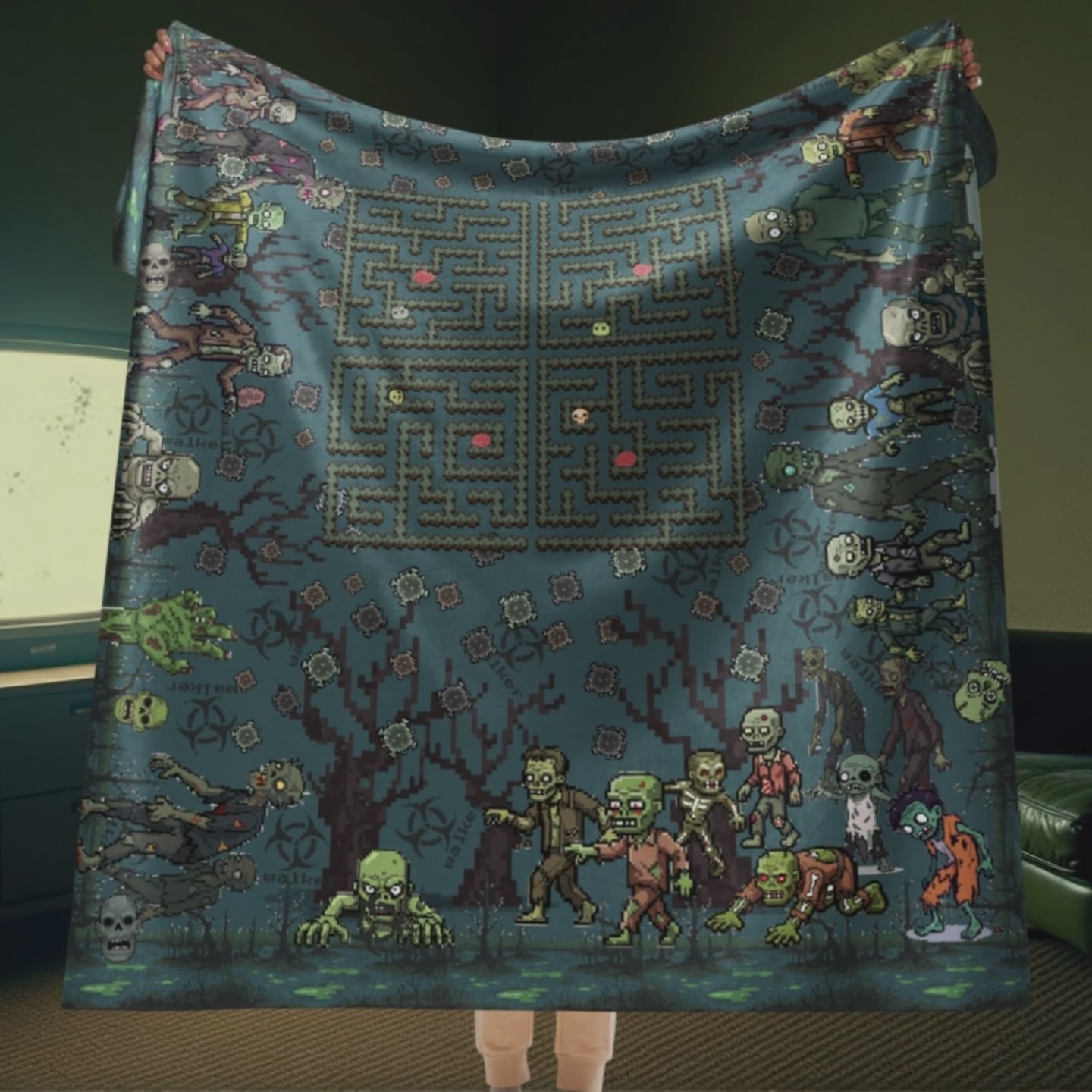 Person holding a large pixel art zombie maze sherpa blanket