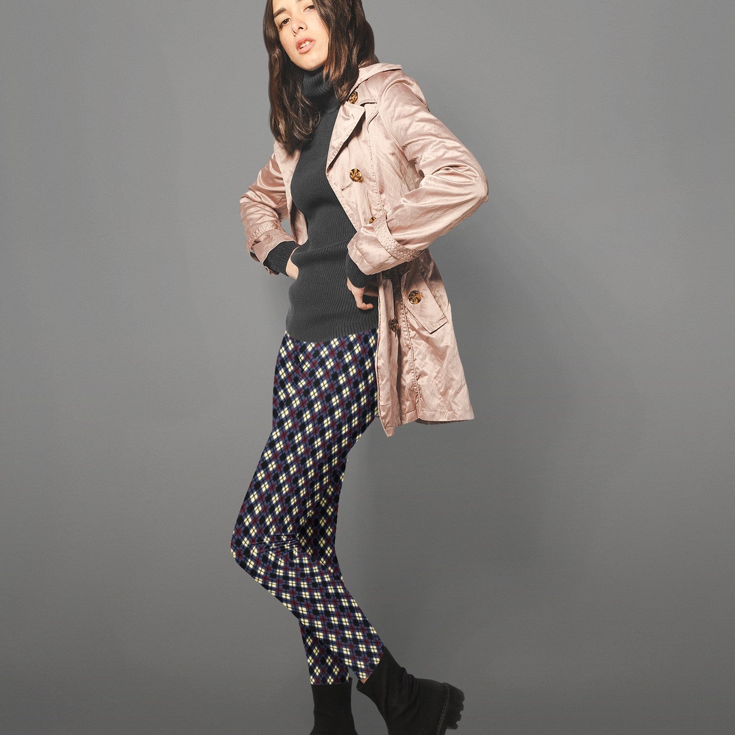 woman wearing leggings with diamond argyle pattern with purple base and black accent