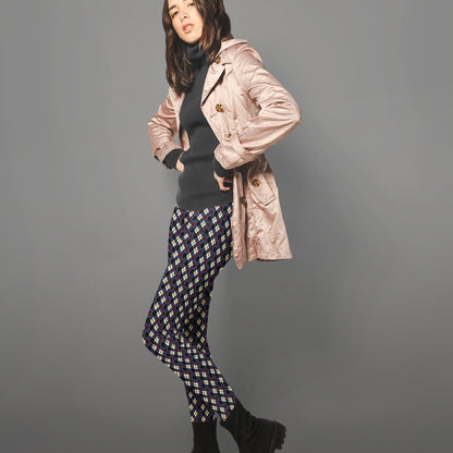 woman wearing leggings with diamond argyle pattern with purple base and black accent