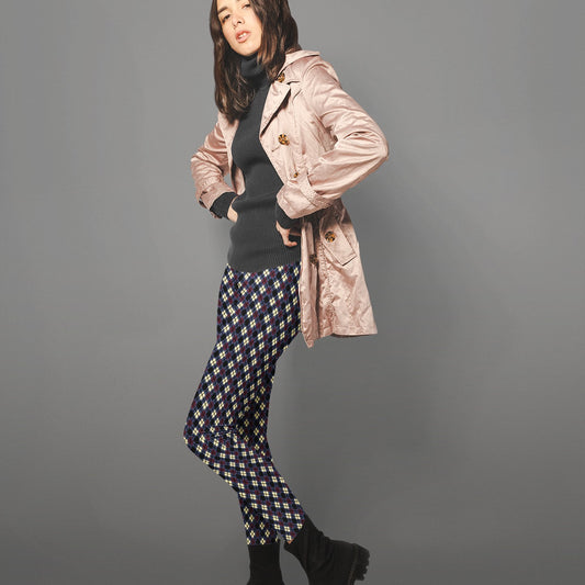 woman wearing leggings with diamond argyle pattern with purple base and black accent