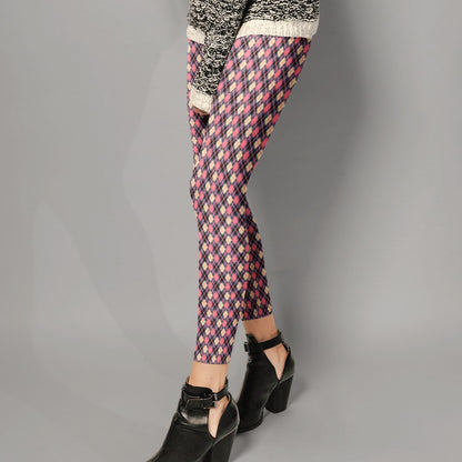 person wearing colorful argyle diamond pattern leggings with purple base and pink accent