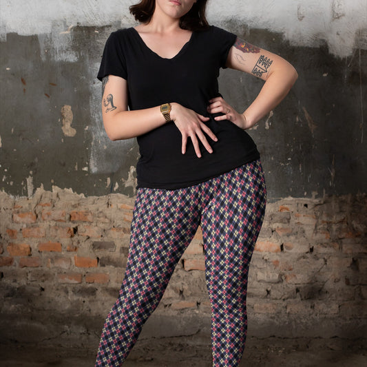 person wearing colorful argyle diamond pattern leggings with purple base and black accent