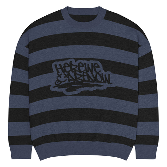 a grunge style dark striped sweater with the text "here we are now"